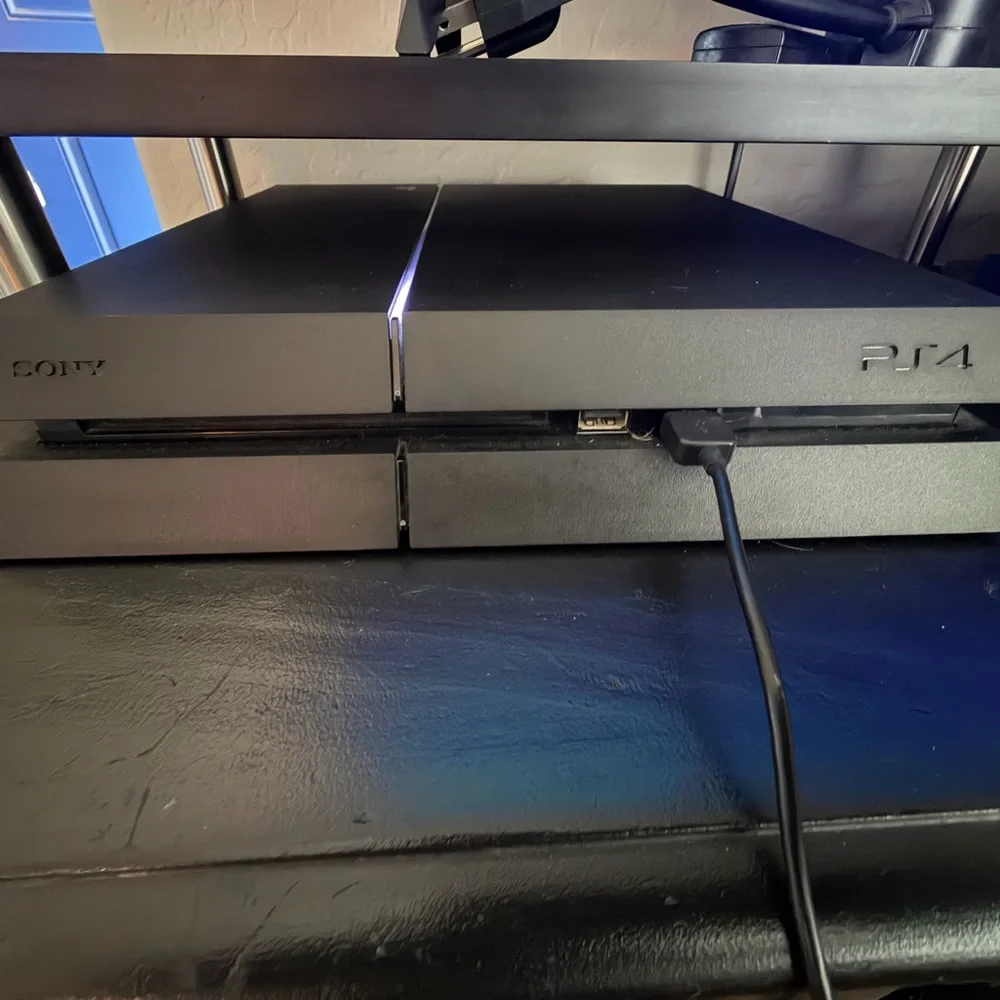 Sony PlayStation 4 with 2 Controllers and 8 Games